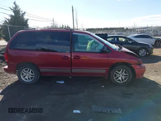 1999 Dodge Caravan z VIN 1B4GP45G7XB554879, wystawiony jako IAAI lot #41644242 z przebiegiem Nie podano mil oraz . Historia ofert i sprzedaży dostępna na DreamBid. Obrazek 14.
