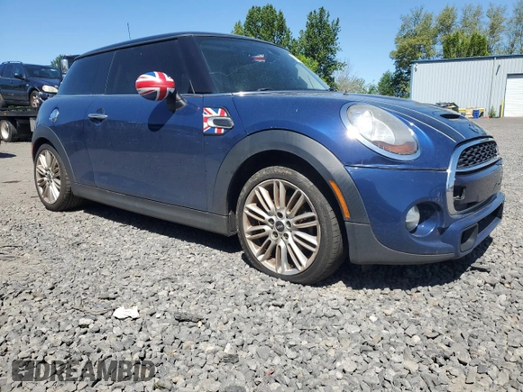 2014 MINI Hardtop S with VIN WMWXM7C51ET926090, listed as a Copart auction lot 55958745 with 148,997 mi miles and Salvage title. Bid and sale history available at DreamBid. Image 4.