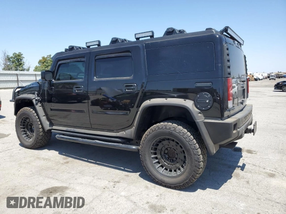 2005 Hummer H2 SUV z VIN 5GRGN23U05H117630, wystawiony jako Copart lot #57087305 z przebiegiem 60 260 mil mil oraz Szkoda całkowita • Salvage title. Historia ofert i sprzedaży dostępna na DreamBid. Obrazek 2.