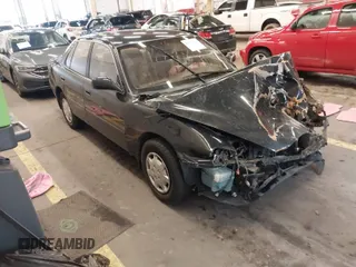 1994 Toyota Camry LE with VIN JT2SK12E3R0207215, listed as a IAAI auction lot 41788670 with 124,010 mi miles. Bid and sale history available at carsss.com. Image 1.