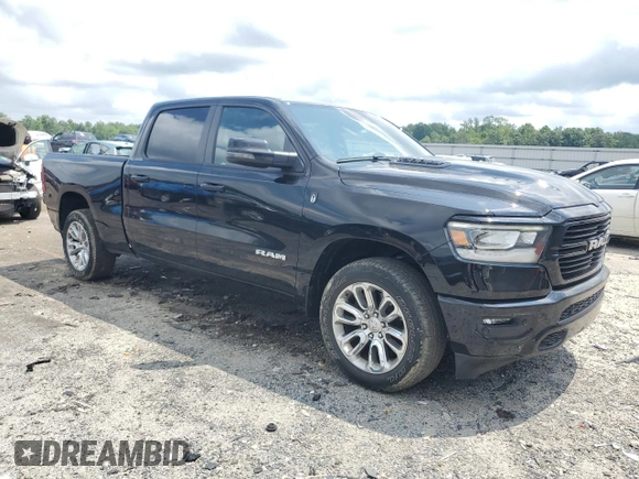 2023 Ram 1500 Laramie with VIN 1C6SRFRT1PN577199, listed as a Copart auction lot 64833895 with 22,119 mi miles and Salvage title. Bid and sale history available at DreamBid. Image 4.