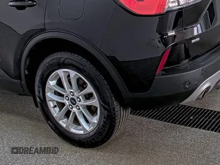 2021 Ford Escape SE with VIN 1FMCU9G60MUA42842, listed as a IAAI auction lot 42791500 with 91,398 mi miles and . Bid and sale history available at DreamBid. Image 32.