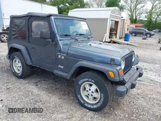 2002 Jeep Wrangler X with VIN 1J4FA39S92P736825, listed as a IAAI auction lot 42156410 with 196,313 mi miles. Bid and sale history available at carsss.com. Image 1.