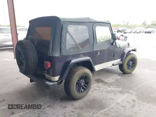 1999 Jeep Wrangler Sport with VIN 1J4FY19S1XP402974, listed as a IAAI auction lot 41659511 with 152,024 mi miles. Bid and sale history available at carsss.com. Image 4.