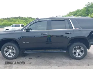2017 Chevrolet Tahoe LT z VIN 1GNSKBKC8HR311969, wystawiony jako IAAI lot #42126414 z przebiegiem 160 994 mil mil oraz . Historia ofert i sprzedaży dostępna na DreamBid. Obrazek 14.