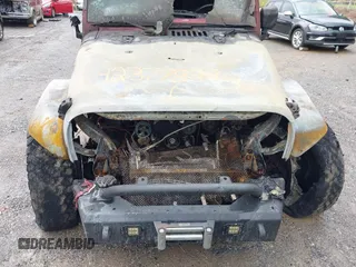 2012 Jeep Wrangler Sport with VIN 1C4AJWAG9CL203018, listed as a IAAI auction lot 42377899 with Not provided miles and . Bid and sale history available at DreamBid. Image 13.