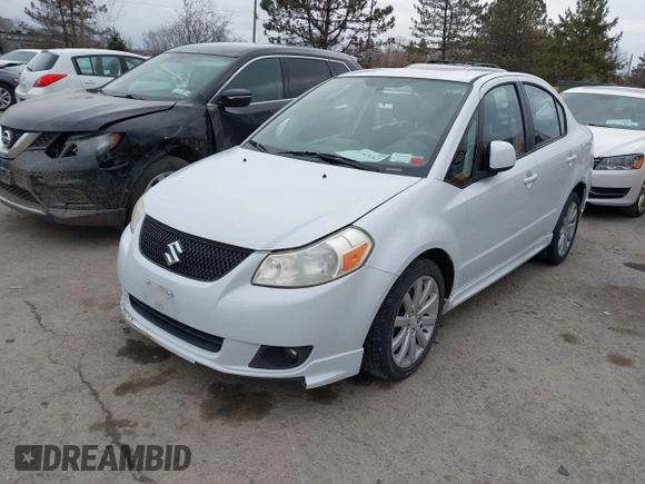 2012 Suzuki SX4 with VIN JS2YC5A52C6300339, listed as a IAAI auction lot 41829263 with 63,717 mi miles and . Bid and sale history available at DreamBid. Image 2.
