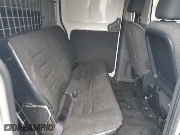 2014 Nissan NV200 SV with VIN 3N6CM0KN9EK699328, listed as a Copart auction lot 86809024 with 77,678 mi miles and Salvage title. Bid and sale history available at DreamBid. Image 11.