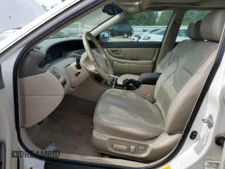 2001 Toyota Avalon XL z VIN 4T1BF28B91U155354, wystawiony jako Copart lot #52393885 z przebiegiem 277 545 mil mil oraz Szkody całkowita. Historia ofert i sprzedaży dostępna na DreamBid. Obrazek 7.