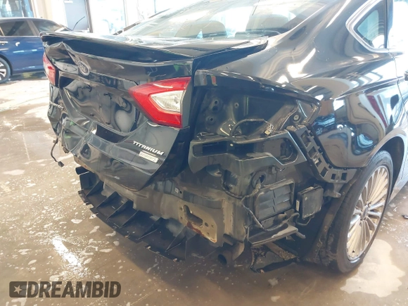 2014 Ford Fusion Titanium with VIN 3FA6P0K93ER115805, listed as a IAAI auction lot 41009602 with 136,021 mi miles. Bid and sale history available at carsss.com. Image 6.