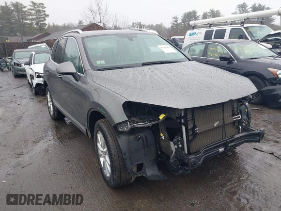 2013 Volkswagen Touareg Lux with VIN WVGEF9BP7DD007170, listed as a IAAI auction lot 41787075 with 131,089 mi miles and . Bid and sale history available at DreamBid. Image 1.
