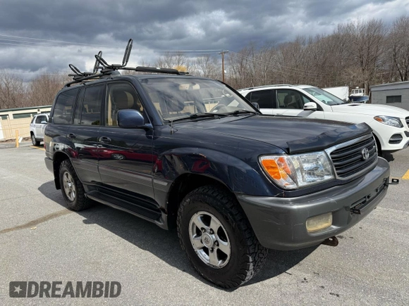 2002 Toyota Land Cruiser z VIN JTEHT05J622022972, wystawiony jako Copart lot #59201475 z przebiegiem 299 548 mil mil oraz Czysty tytuł • Clean title. Historia ofert i sprzedaży dostępna na DreamBid. Obrazek 1.