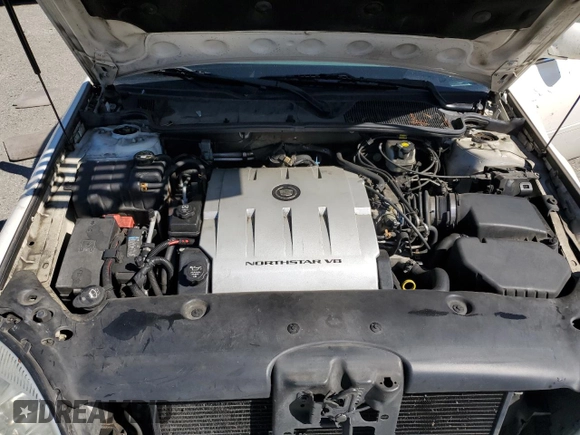 2005 Cadillac DeVille z VIN 1G6KD54Y65U100231, wystawiony jako Copart lot #55758605 z przebiegiem 166 871 mil mil oraz Szkoda całkowita • Salvage title. Historia ofert i sprzedaży dostępna na DreamBid. Obrazek 11.