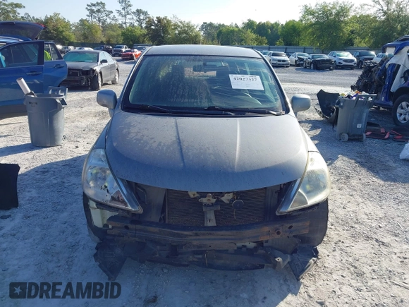 2012 Nissan Versa S with VIN 3N1BC1CP8CK242212, listed as a IAAI auction lot 42027327 with 117,118 mi miles. Bid and sale history available at carsss.com. Image 12.