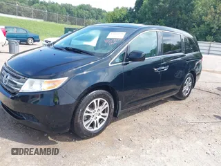 2011 Honda Odyssey EX-L with VIN 5FNRL5H69BB037248, listed as a IAAI auction lot 42613070 with 101,008 mi miles and . Bid and sale history available at DreamBid. Image 2.