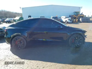 2022 Tesla Model Y Performance with VIN 7SAYGDEFXNF313636, listed as a IAAI auction lot 41660019 with 30,258 mi miles and . Bid and sale history available at DreamBid. Image 14.