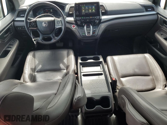 2018 Honda Odyssey EX-L z VIN 5FNRL6H7XJB031245, wystawiony jako Copart lot #59331635 z przebiegiem 74 901 mil mil oraz Czysty tytuł • Clean title. Historia ofert i sprzedaży dostępna na DreamBid. Obrazek 8.