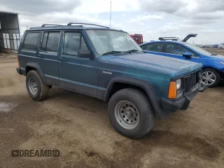 1996 Jeep Cherokee Sport with VIN 1J4FJ68S3TL251074, listed as a Copart auction lot 59593955 with 181,482 mi miles and Salvage title. Bid and sale history available at DreamBid. Image 4.