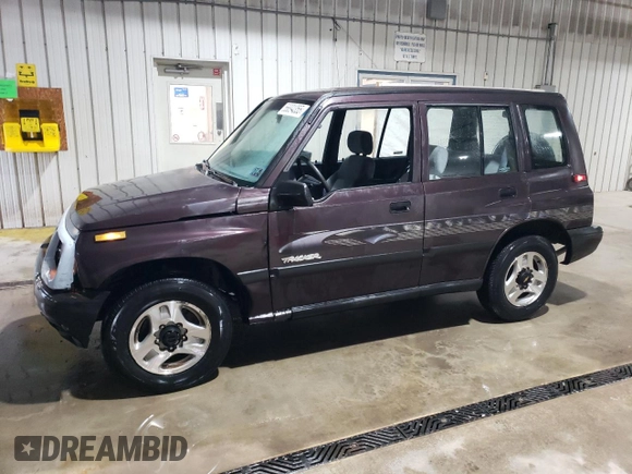 1998 Chevrolet Tracker z VIN 2CNBJ1362W6919635, wystawiony jako Copart lot #56894355 z przebiegiem 140 298 mil mil oraz Szkoda całkowita • Salvage title. Historia ofert i sprzedaży dostępna na DreamBid. Obrazek 1.