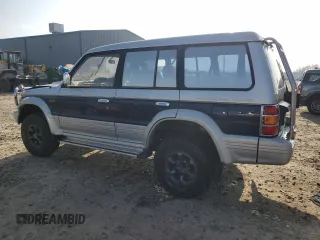 1995 Mitsubishi Montero z VIN V464049505, wystawiony jako Copart lot #83484024 z przebiegiem 158 151 mil mil oraz Szkoda całkowita • Salvage title. Historia ofert i sprzedaży dostępna na DreamBid. Obrazek 2.