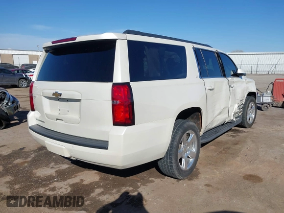 2015 Chevrolet Suburban LT with VIN 1GNSKJKC9FR717038, listed as a IAAI auction lot 41815942 with 123,095 mi miles and . Bid and sale history available at DreamBid. Image 4.