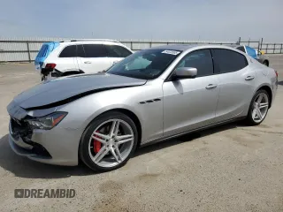 2014 Maserati Ghibli z VIN ZAM57XSA3E1091486, wystawiony jako Copart lot #54623505 z przebiegiem 108 474 mil mil oraz Szkody całkowita. Historia ofert i sprzedaży dostępna na DreamBid. Obrazek 1.