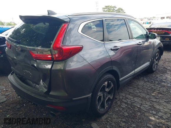 2018 Honda CR-V Touring z VIN 7FARW1H9XJE040530, wystawiony jako IAAI lot #42227446 z przebiegiem 101 299 mil mil oraz . Historia ofert i sprzedaży dostępna na DreamBid. Obrazek 4.