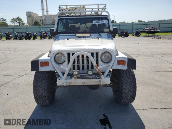 1999 Jeep Wrangler Sport with VIN 1J4FY19SXXP464096, listed as a Copart auction lot 61233105 with 167,350 mi miles and Clean title. Bid and sale history available at DreamBid. Image 5.