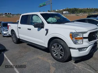 2021 Ford F-150 XL with VIN 1FTEW1CP2MKE42968, listed as a IAAI auction lot 42022454 with 32,908 mi miles. Bid and sale history available at carsss.com. Image 1.
