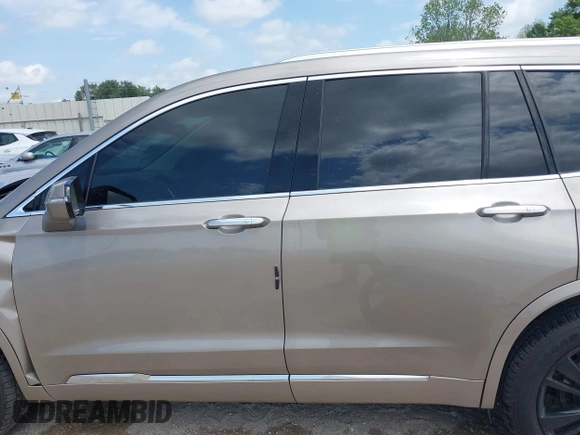 2022 Cadillac XT6 Premium Luxury z VIN 1GYKPCRS4NZ107852, wystawiony jako IAAI lot #42075012 z przebiegiem 66 046 mil mil oraz . Historia ofert i sprzedaży dostępna na DreamBid. Obrazek 14.