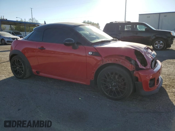 2015 MINI Coupe S z VIN WMWSX3C59FT409468, wystawiony jako Copart lot #71401384 z przebiegiem Nie podano mil oraz Szkoda całkowita • Salvage title. Historia ofert i sprzedaży dostępna na DreamBid. Obrazek 4.