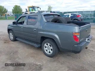 2007 Honda Ridgeline RTL z VIN 2HJYK16517H511157, wystawiony jako IAAI lot #42257637 z przebiegiem 266 894 mil mil oraz . Historia ofert i sprzedaży dostępna na DreamBid. Obrazek 3.