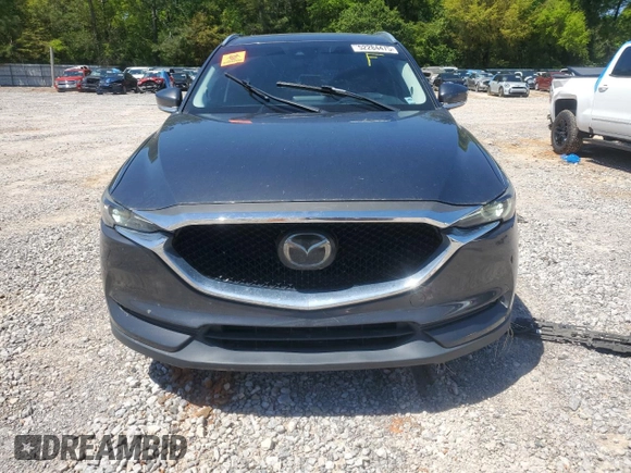 2018 Mazda CX-5 Grand Touring with VIN JM3KFADM9J0343621, listed as a Copart auction lot 52284475 with 129,776 mi miles and Salvage Title. Bid and sale history available at DreamBid. Image 5.