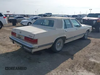 1991 Mercury Grand Marquis z VIN 2MECM75F7MX637786, wystawiony jako IAAI lot #41429297 z przebiegiem 12 512 mil mil oraz . Historia ofert i sprzedaży dostępna na DreamBid. Obrazek 4.