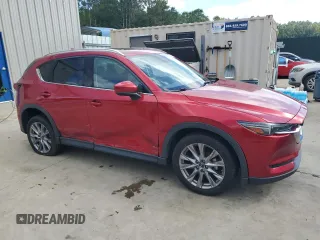 2019 Mazda CX-5 Grand Touring with VIN JM3KFADM2K1657915, listed as a Copart auction lot 56647145 with 85,095 mi miles and Salvage title. Bid and sale history available at DreamBid. Image 4.
