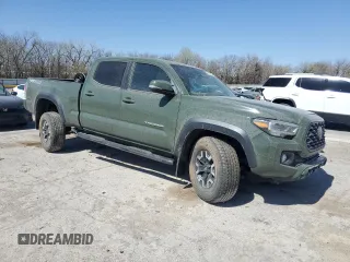 2021 Toyota Tacoma 4WD SR5 with VIN 3TMDZ5BN2MM101766, listed as a Copart auction lot 50015205 with 29,176 mi miles and Salvage Title. Bid and sale history available at carsss.com. Image 4.