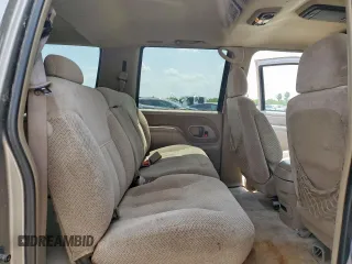 1999 Chevrolet Suburban z VIN 3GNFK16R2XG191868, wystawiony jako Copart lot #57620165 z przebiegiem 128 526 mil mil oraz Szkoda całkowita • Salvage title. Historia ofert i sprzedaży dostępna na DreamBid. Obrazek 11.