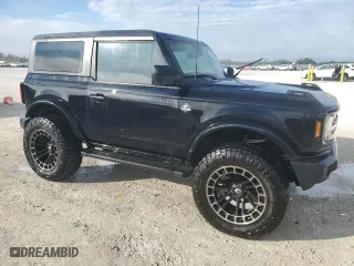 2022 Ford Bronco with VIN 1FMDE5AHXNLB04601, listed as a Copart auction lot 85704284 with 34,708 mi miles and Salvage Title. Bid and sale history available at carsss.com. Image 4.