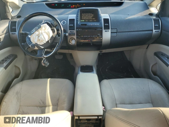 2007 Toyota Prius z VIN JTDKB20UX77600124, wystawiony jako Copart lot #61400525 z przebiegiem 102 957 mil mil oraz Czysty tytuł • Clean title. Historia ofert i sprzedaży dostępna na DreamBid. Obrazek 8.