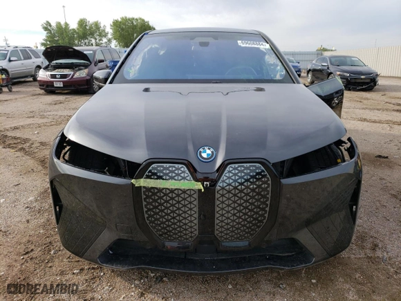2023 BMW iX M60 with VIN WB533CF03PCM65597, listed as a Copart auction lot 69608884 with 4,793 mi miles and Salvage Title. Bid and sale history available at carsss.com. Image 5.