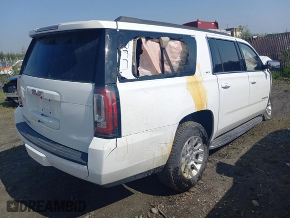 2019 GMC Yukon XL SLT with VIN 1GKS2GKC1KR279755, listed as a Copart auction lot 64695394 with 0 mi miles and Salvage Title. Bid and sale history available at carsss.com. Image 3.