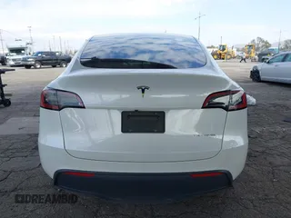 2023 Tesla Model Y Long Range with VIN 7SAYGAEE7PF607195, listed as a IAAI auction lot 41819147 with 74,694 mi miles. Bid and sale history available at carsss.com. Image 16.
