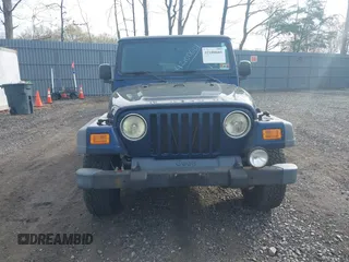 2005 Jeep Wrangler Sport with VIN 1J4FA49S25P302627, listed as a IAAI auction lot 42100601 with 169,650 mi miles. Bid and sale history available at carsss.com. Image 12.