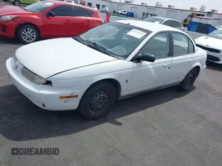 1998 Saturn SL z VIN 1G8ZJ5272WZ312413, wystawiony jako IAAI lot #41874493 z przebiegiem 229 200 mil mil oraz . Historia ofert i sprzedaży dostępna na DreamBid. Obrazek 2.