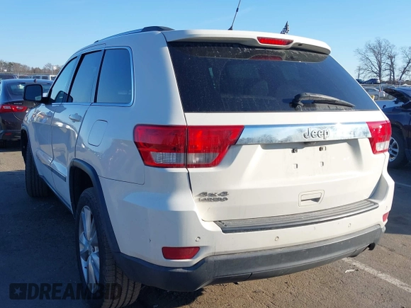 2012 Jeep Grand Cherokee Laredo with VIN 1C4RJFAG5CC310893, listed as a IAAI auction lot 41695279 with 136,821 mi miles. Bid and sale history available at carsss.com. Image 3.