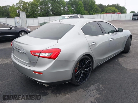 2015 Maserati Ghibli S Q4 with VIN ZAM57RTA2F1146411, listed as a IAAI auction lot 42359547 with 95,937 mi miles and . Bid and sale history available at DreamBid. Image 4.