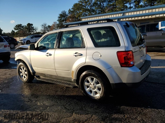 2010 Mazda Tribute Grand Touring with VIN 4F2CY0C74AKM03659, listed as a Copart auction lot 84494254 with 160,177 mi miles and Salvage Title. Bid and sale history available at carsss.com. Image 2.
