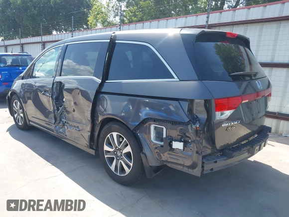 2014 Honda Odyssey Touring with VIN 5FNRL5H99EB075979, listed as a IAAI auction lot 42520154 with 99,314 mi miles and . Bid and sale history available at DreamBid. Image 3.