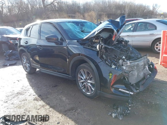 2021 Mazda CX-5 Grand Touring with VIN JM3KFBDM0M1357587, listed as a IAAI auction lot 41680245 with 1 mi miles. Bid and sale history available at carsss.com. Image 1.