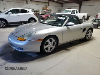 1998 Porsche Boxster z VIN WP0CA2986WU622859, wystawiony jako Copart lot #49951275 z przebiegiem 106 180 mil mil oraz Czysty tytuł • Clean title. Historia ofert i sprzedaży dostępna na DreamBid. Obrazek 1.